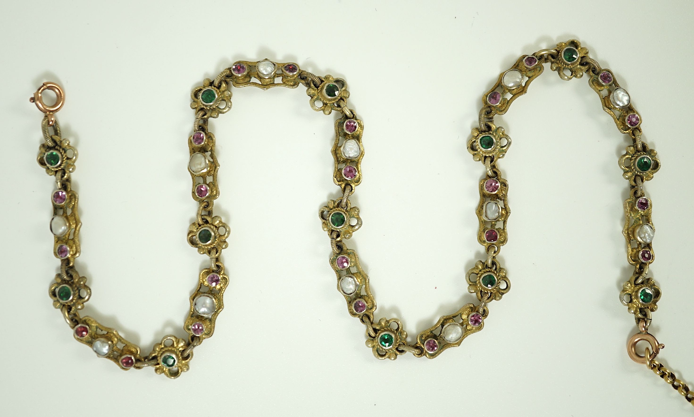 An early 20th century pierced and engraved silver gilt and gem set choker necklace, in the Suffragette colours